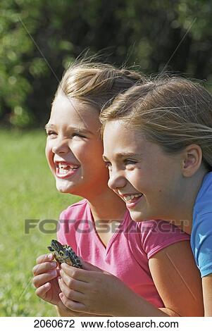 Six And Eight Year Old Sisters With Turtle, Winnipeg, Canada View Large Photo Image Stock Image - Six And Eight Year Old Sisters With Turtle, Winnipeg, Canada. Fotosearch