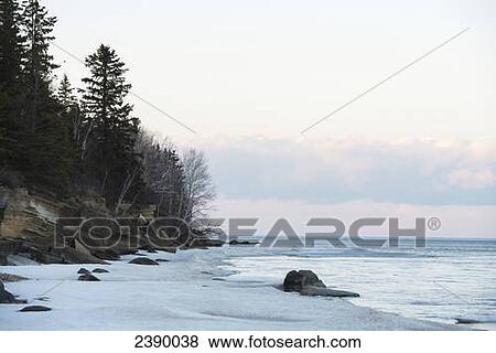 Stock Photo - Snow along the shoreline of Lake Winnipeg, Hecla-Grindstone Provincial Park; Riverton, Manitoba, Canada . Fotosearch