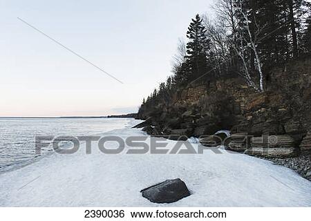 Stock Photograph - Snow along the shoreline of Lake Winnipeg, Hecla-Grindstone Provincial Park; Riverton, Manitoba, Canada . Fotosearch