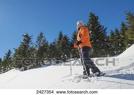 Picture - Snowshoeing in the Swiss Alps; San Bernardino, Grisons, Switzerland . Fotosearch