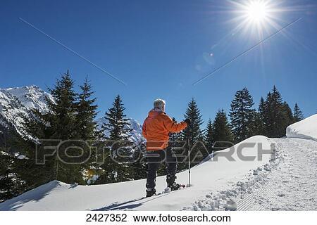 Stock Image - Snowshoeing in the Swiss Alps; San Bernardino, Grisons, Switzerland . Fotosearch