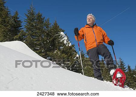 Stock Photo - Snowshoeing in the Swiss Alps; San Bernardino, Grisons, Switzerland . Fotosearch