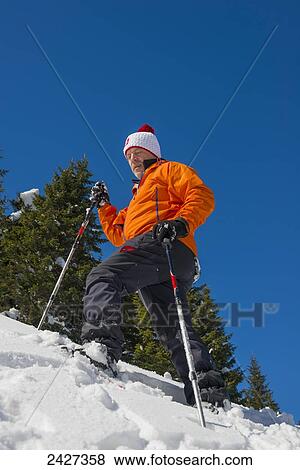 Snowshoeing in the Swiss Alps; San Bernardino, Grisons, Switzerland View Large Photo Image Stock Photo - Snowshoeing in the Swiss Alps; San Bernardino, Grisons, Switzerland . Fotosearch