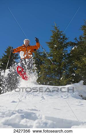 Stock Photograph - Snowshoeing in the Swiss Alps; San Bernardino, Grisons, Switzerland . Fotosearch