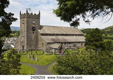 Stone church with clock tower and cemetery in a village; Hawkshead, Cumbria, England View Large Photo Image Stock Photography - Stone church with clock tower and cemetery in a village; Hawkshead, Cumbria, England. Fotosearch