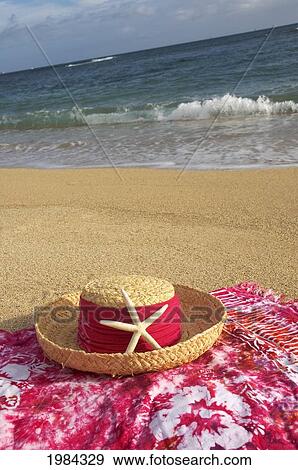 Straw Hat With Dark Pink Band And Seastar On Dark Pink And White Batik Pareo (Sarong), Beach, Ocean And Sky Background. View Large Photo Image Stock Photo - Straw Hat With Dark Pink Band And Seastar On Dark Pink And White Batik Pareo (Sarong), Beach, Ocean And Sky Background.. Fotosearch