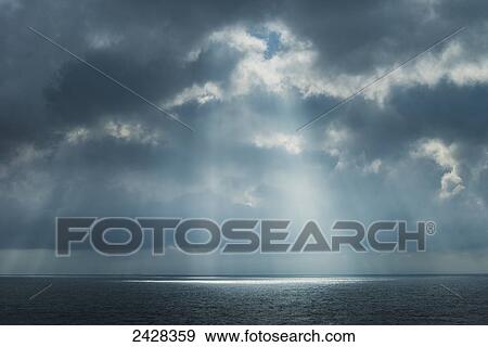 Sunlight coming through clouds on ferry between Dover and Calais; England View Large Photo Image Stock Photo - Sunlight coming through clouds on ferry between Dover and Calais; England. Fotosearch