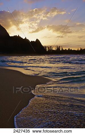 Stock Photography - Sunrise at Tunnels Beach; Kauai, Hawaii, United States of America. Fotosearch