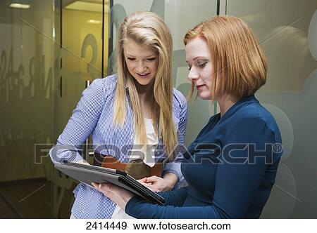 Stock Photograph - Supervisor assisting intern with procedures; Edmonton, Alberta, Canada. Fotosearch - Search Stock Photography, Posters, Pictures, and Photo Clipart Images