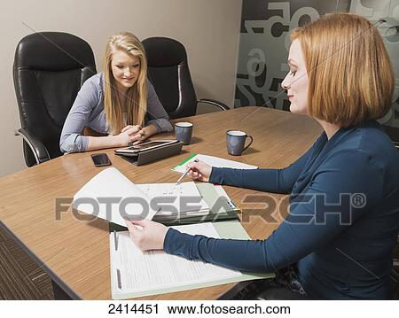 Supervisor teaching intern about accounting practises; Edmonton, Alberta, Canada View Large Photo Image Stock Image - Supervisor teaching intern about accounting practises; Edmonton, Alberta, Canada. Fotosearch