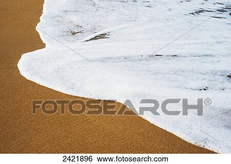 Surf caresses the sand on Waipouli Beach; Kauai, Hawaii, United States of America View Large Photo Image Stock Photograph - Surf caresses the sand on Waipouli Beach; Kauai, Hawaii, United States of America. Fotosearch