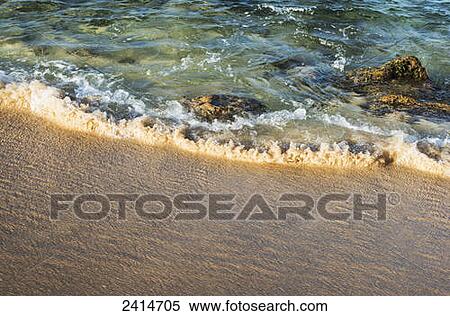 Surf lifts the sand from the beach; Waipouli, Hawaii, United States of America View Large Photo Image Stock Photography - Surf lifts the sand from the beach; Waipouli, Hawaii, United States of America. Fotosearch