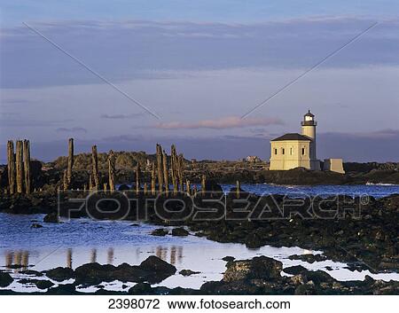 Stock Image - The Coquille River Lighthouse marks the mouth of the Coquille River; Bandon, Oregon, United States of America. Fotosearch