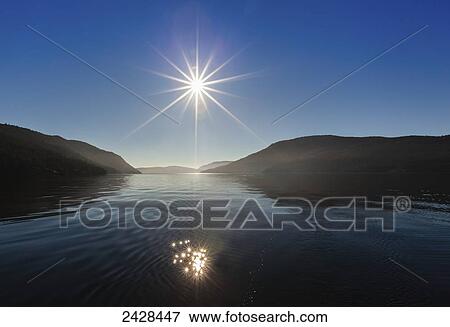 The sun rises over Sansum Narrows on Vancouver Island; Duncan, British Columbia, Canada View Large Photo Image Stock Photo - The sun rises over Sansum Narrows on Vancouver Island; Duncan, British Columbia, Canada. Fotosearch