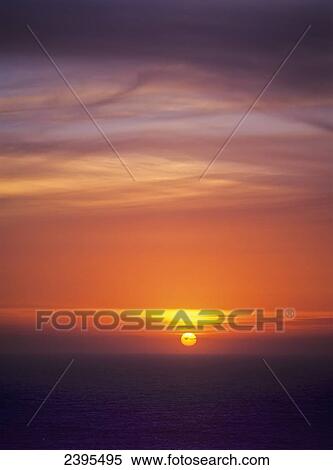 The sun sets over the Pacific Ocean; Florence, Oregon, United States of America View Large Photo Image Stock Photography - The sun sets over the Pacific Ocean; Florence, Oregon, United States of America. Fotosearch