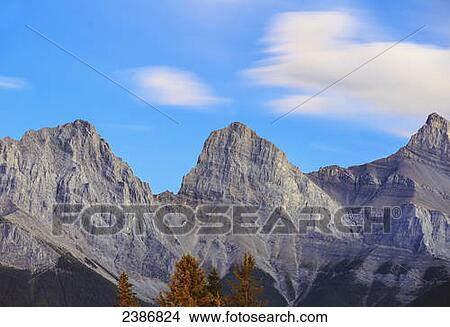 The Three Sisters mountain peaks; Canmore, Alberta, Canada View Large Photo Image Picture - The Three Sisters mountain peaks; Canmore, Alberta, Canada. Fotosearch