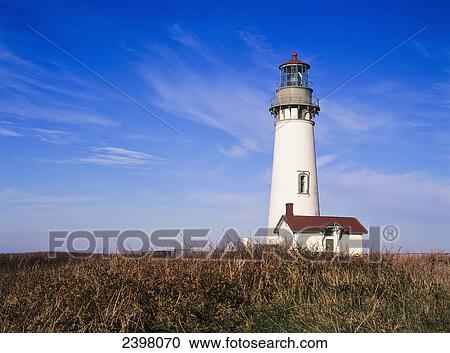 Stock Image - The Yaquina Head Lighthouse is found near Newport; Oregon, United States of America. Fotosearch
