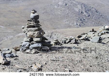 Tibetan prayer pyramid at the mountain pass; Tibet View Large Photo Image Stock Photography - Tibetan prayer pyramid at the mountain pass; Tibet. Fotosearch