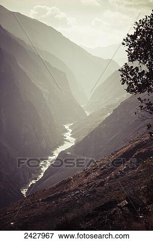 Tiger Leaping Gorge, the deepest river canyon; Yunnon Province, China View Large Photo Image Stock Photo - Tiger Leaping Gorge, the deepest river canyon; Yunnon Province, China. Fotosearch