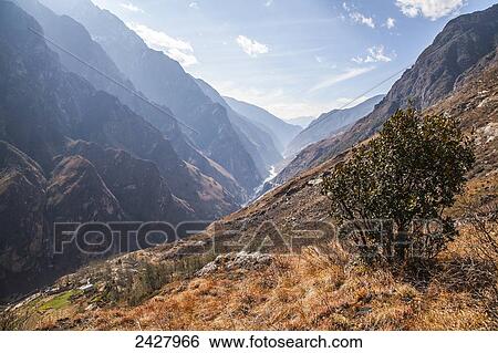 Tiger Leaping Gorge, the deepest river canyon; Yunnon Province, China View Large Photo Image Stock Photograph - Tiger Leaping Gorge, the deepest river canyon; Yunnon Province, China. Fotosearch
