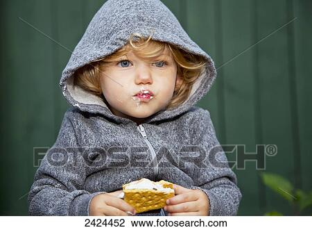 Toddler eating a s'more treat; St. Albert, Alberta, Canada View Large Photo Image Stock Image - Toddler eating a s'more treat; St. Albert, Alberta, Canada. Fotosearch