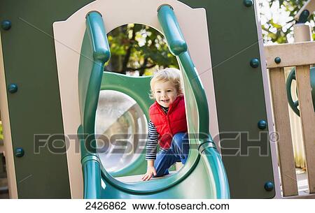 Toddler playing at a playground; Langley, British Columbia, Canada View Large Photo Image Stock Image - Toddler playing at a playground; Langley, British Columbia, Canada. Fotosearch