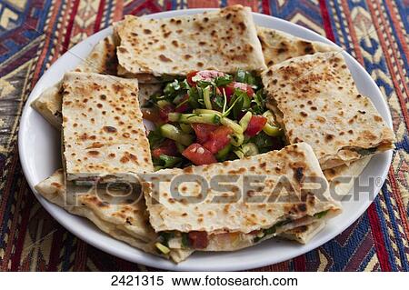 Stock Photography - Traditional Cappadocian dish called Gozleme; Goreme, Cappadocia, Turkey. Fotosearch