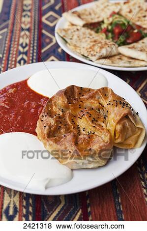 Stock Photo - Traditional Cappadocian dish; Goreme, Cappadocia, Turkey. Fotosearch