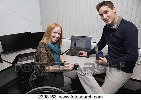 Stock Image - Training to use computer with special functions for persons with disabilities; Edmonton, Alberta, Canada. Fotosearch