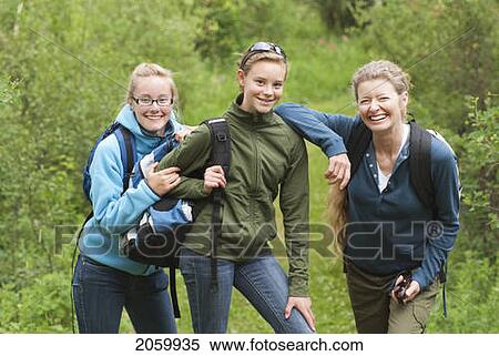 Stock Photography - Two Girls And Woman Posed On Hiking Trail, Manitoba, Canada. Fotosearch