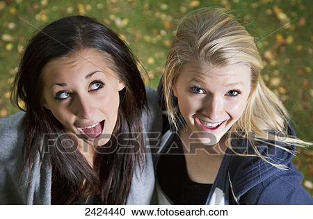 Two teenagers with humorous poses for the camera; Edmonton, Alberta, Canada View Large Photo Image Stock Image - Two teenagers with humorous poses for the camera; Edmonton, Alberta, Canada. Fotosearch