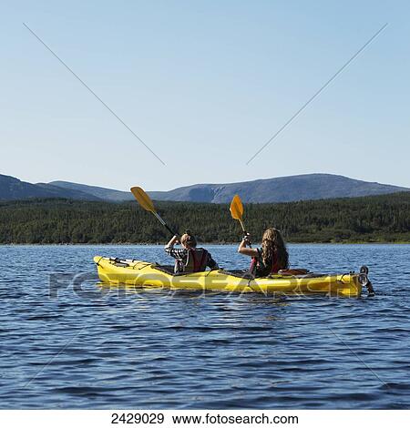 Two young women kayaking in Gros Morne National Park; Trout River, Newfoundland, Canada View Large Photo Image Stock Photo - Two young women kayaking in Gros Morne National Park; Trout River, Newfoundland, Canada. Fotosearch