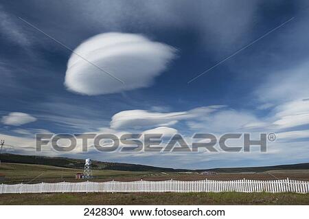 Picture - Unique cloud formation above Cerro Castillo National Reserve; Cerro Castillo, Chile. Fotosearch