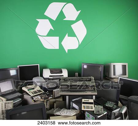 Used computers, printers and office equipment for recycling and a large recycling sign; Edmonton, Alberta, Canada View Large Photo Image Stock Photo - Used computers, printers and office equipment for recycling and a large recycling sign; Edmonton, Alberta, Canada. Fotosearch