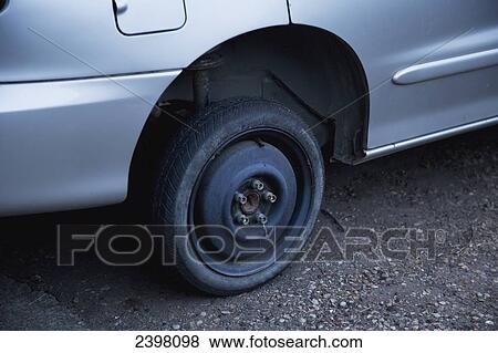 Vehicle with emergency spare tire; Edmonton, Alberta, Canada View Large Photo Image Stock Photo - Vehicle with emergency spare tire; Edmonton, Alberta, Canada. Fotosearch