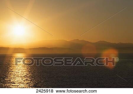 View from a BC Ferry destined for Swartz Bay, near Active Pass in Strait of Georgia at sunset; British Columbia, Canada View Large Photo Image Stock Photo - View from a BC Ferry destined for Swartz Bay, near Active Pass in Strait of Georgia at sunset; British Columbia, Canada. Fotosearch