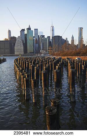 View of financial district of Manhattan from Brooklyn Bridge Park at sunset; New York City, New York, United States of America View Large Photo Image Stock Image - View of financial district of Manhattan from Brooklyn Bridge Park at sunset; New York City, New York, United States of America. Fotosearch