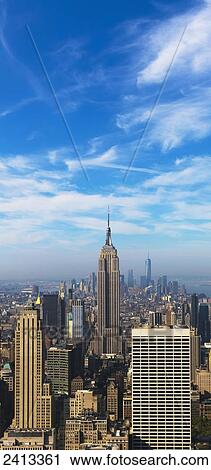 Stock Image - View of the Empire State Building and Manhattan from the Top of the Rock Observation Tower at the Rockefeller Center; New York City, New York, United States of America. Fotosearch