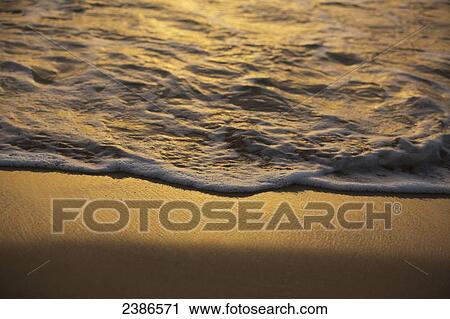 Water and foam rolling onto the beach at sunset; Barbados View Large Photo Image Stock Image - Water and foam rolling onto the beach at sunset; Barbados. Fotosearch