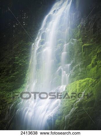 Water cascades down green moss covered rocks; Sisters, Oregon, United States of America View Large Photo Image Stock Photo - Water cascades down green moss covered rocks; Sisters, Oregon, United States of America. Fotosearch