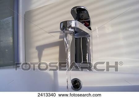 Water running out of a tap; London, England View Large Photo Image Stock Image - Water running out of a tap; London, England. Fotosearch