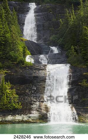 Waterfall emptying into Endicott Arm, fjord in Tracy Arm-Fords Terror Wilderness, South of Juneau; Alaska, United States of America View Large Photo Image Stock Photograph - Waterfall emptying into Endicott Arm, fjord in Tracy Arm-Fords Terror Wilderness, South of Juneau; Alaska, United States of America. Fotosearch