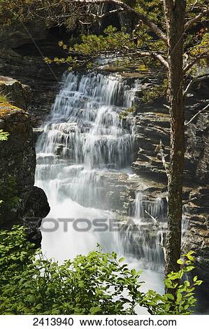 Waterfalls over rock on a cliff face; Andalsnes, Rauma, Norway View Large Photo Image Stock Image - Waterfalls over rock on a cliff face; Andalsnes, Rauma, Norway. Fotosearch