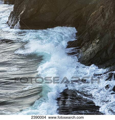 Picture - Waves crashing against the rugged atlantic coast; Port Rexton, Newfoundland and Labrador, Canada. Fotosearch