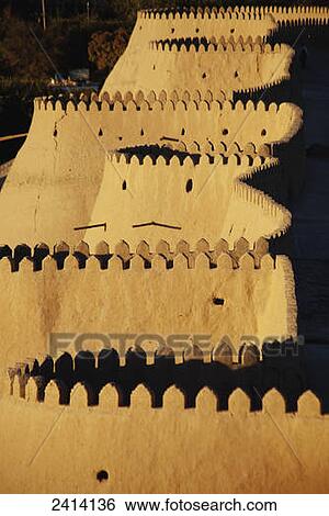 Stock Photograph - Western walls at sunset, Ichan Kala Old City, Khiva, Kizilkum desert; Khwarezm region, Uzbekistan. Fotosearch