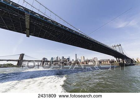 Williamsburg Bridge, as seen from the East River, New York City, New York, United States View Large Photo Image Stock Photo - Williamsburg Bridge, as seen from the East River, New York City, New York, United States. Fotosearch
