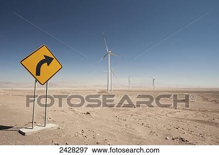 Wind turbines in the Atacama desert with a yellow sign indicating a curve; Calama, Chile View Large Photo Image Stock Photo - Wind turbines in the Atacama desert with a yellow sign indicating a curve; Calama, Chile. Fotosearch