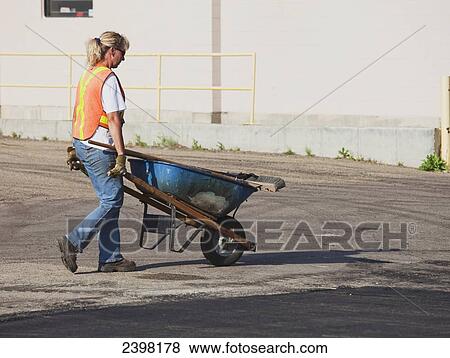Woman at work on a paving crew; Edmonton, Alberta, Canada View Large Photo Image Stock Photo - Woman at work on a paving crew; Edmonton, Alberta, Canada. Fotosearch