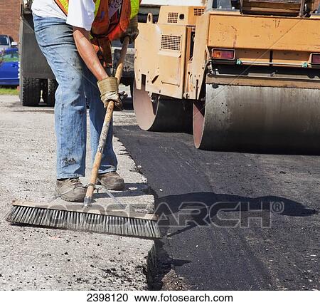 Work crew repairing pot holes in a parking lot; Edmonton, Alberta, Canada View Large Photo Image Stock Image - Work crew repairing pot holes in a parking lot; Edmonton, Alberta, Canada. Fotosearch