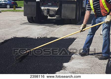 Work crew repairing pot holes in a parking lot; Edmonton, Alberta, Canada View Large Photo Image Stock Photograph - Work crew repairing pot holes in a parking lot; Edmonton, Alberta, Canada. Fotosearch